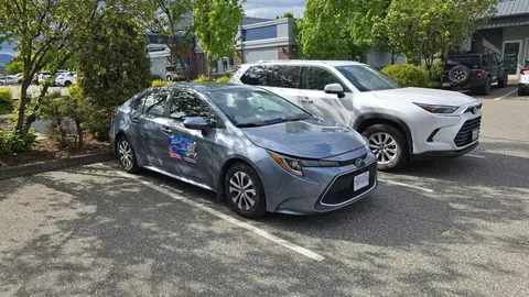 The Right of Way training car, a grey Toyota Corolla Hybrid, parked in a lot